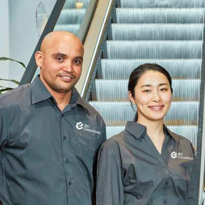 Staff interacting whilst cleaning in a retail environment