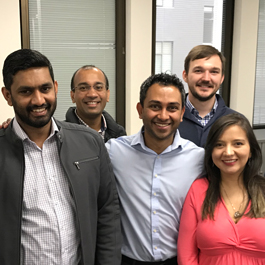 A group of consolidated staff posing for a photo in our office